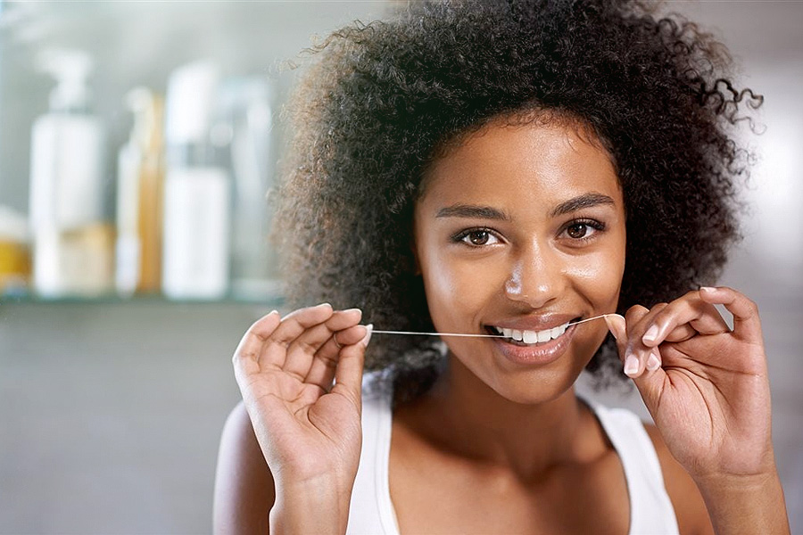 girl cleaning her teeth
